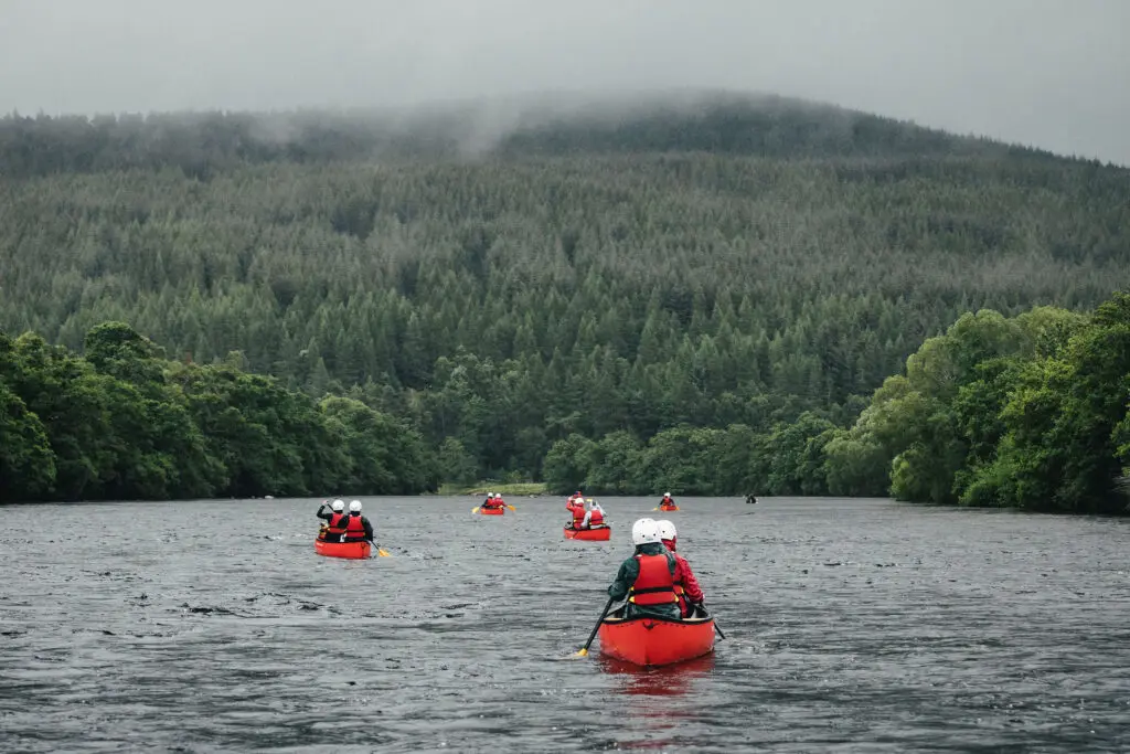 A group of Young People canoeing in Scotland to achieve there Duke of Edinburgh Award.